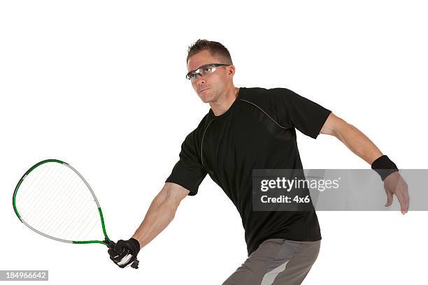 man playing squash - racketball stock pictures, royalty-free photos & images