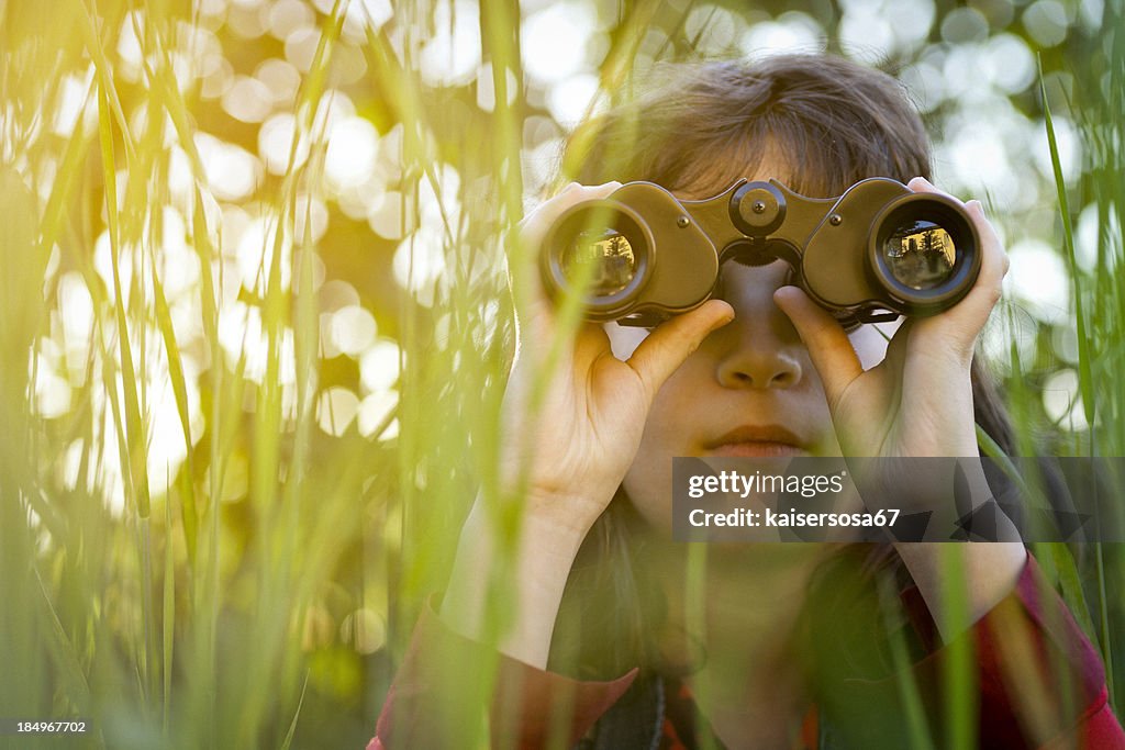 Young girl with binoculars