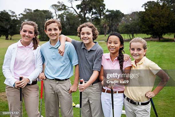 group of children on golf driving range - golf lessons stock pictures, royalty-free photos & images