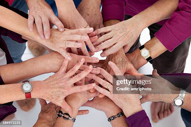 hands stick together - liver spot stock pictures, royalty-free photos & images