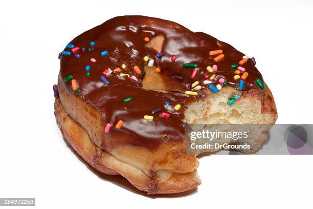 donut bite - biting donut stock pictures, royalty-free photos & images