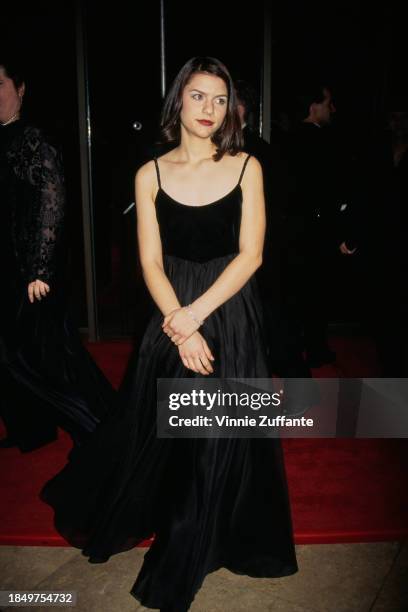 American actress Claire Danes, wearing a black scoop neck evening gown, attends the 52nd Golden Globe Awards, held at the Beverly Hilton Hotel in...