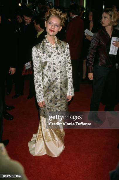 American actress Claire Danes, wearing a silver Prada jacket with floral decoration, and a gold skirt, attends the Los Angeles premiere of 'Romeo +...