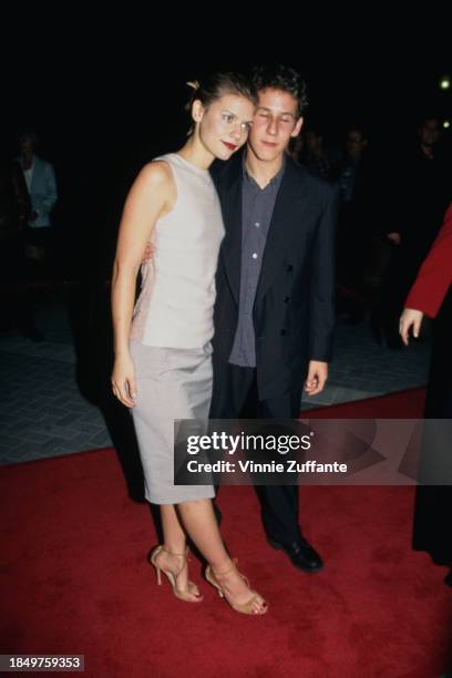 American actress Claire Danes, wearing a sleeveless light grey top with a grey skirt, and Australian musician and actor Ben Lee attend the Hollywood...