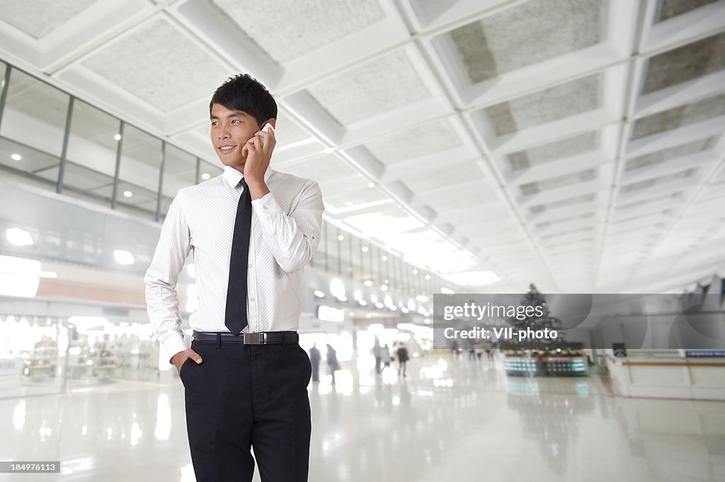 Young business man using cellphone