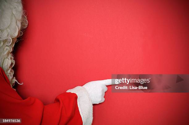 santa claus pointing.copy space. - lisa fringer stock pictures, royalty-free photos & images