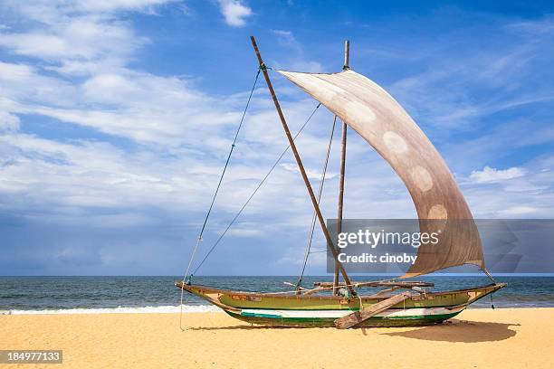 outrigger prahu or proa on the beach in sri lanka - negombo stockfoto's en -beelden