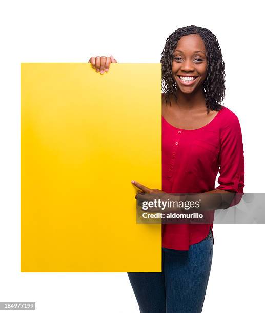 beautiful young woman pointing at sign - name placard stock pictures, royalty-free photos & images