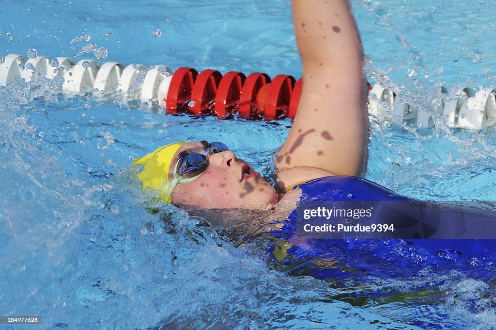 Backstroke Swim Racing Female Youth Child Backstroke Swimmer Racing In Swimming Pool High-Res ...