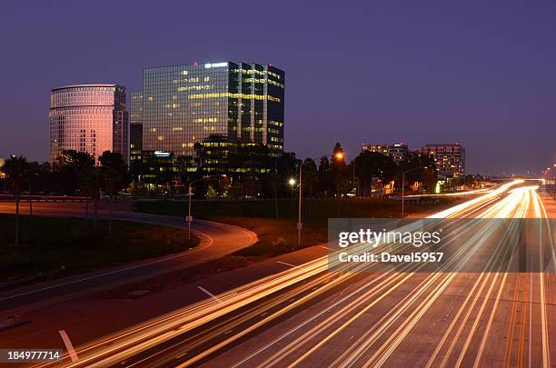 costa mesa and the 405 freeway at dusk - costa mesa stock pictures, royalty-free photos & images