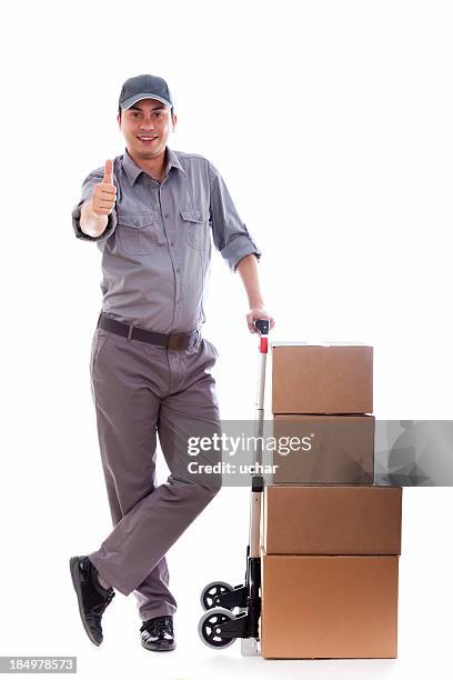 man holding a push cart with boxes giving a thumbs up - delivery person on white stock pictures, royalty-free photos & images