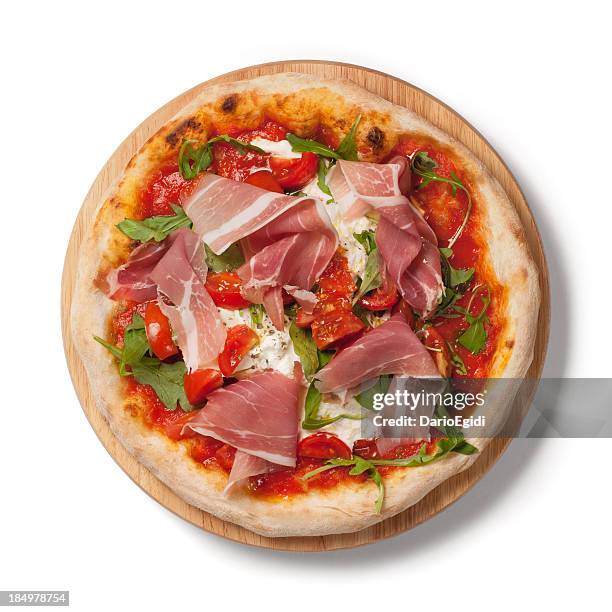 pizza with fresh tomatoes, arugula, parma ham on wodden plate - parma pizza stock pictures, royalty-free photos & images