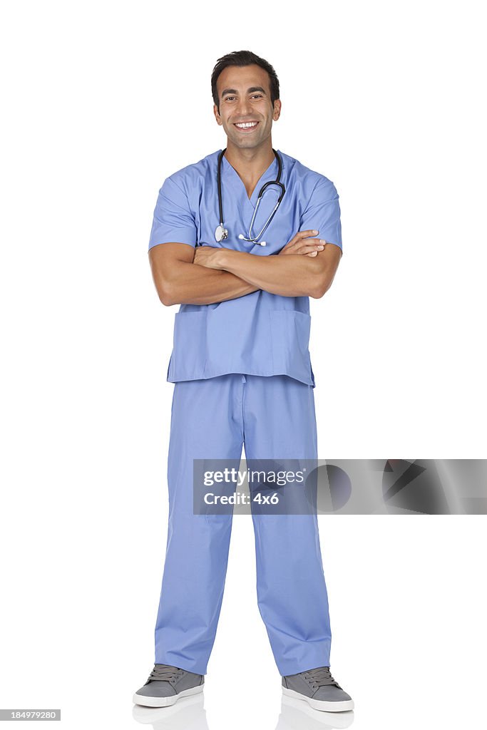 Male surgeon standing with his arms crossed