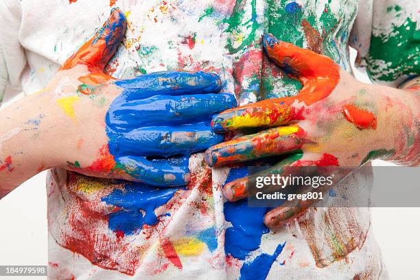 paint soiled hands being wiped on a white shirt - stain stock pictures, royalty-free photos & images