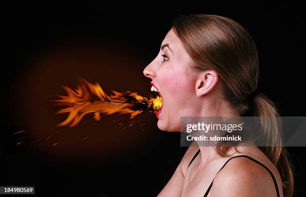 too much chili pepper - woman mouth stock pictures, royalty-free photos & images