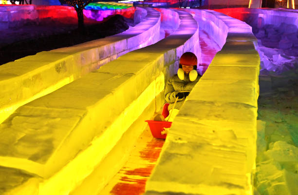 CHN: 512.6-meter-long Ice Slide Attracts Tourists In Changchun