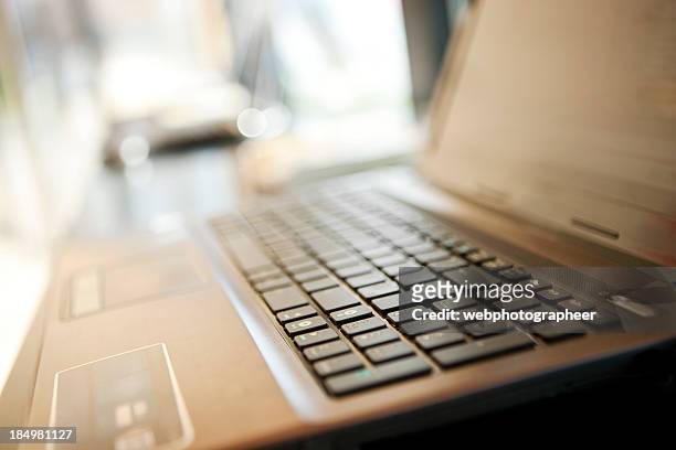 electronics store - laptops in a row stock pictures, royalty-free photos & images