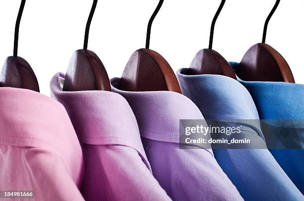 close-up of pink, blue button down shirts hanging on hangers - white button down shirt stock pictures, royalty-free photos & images