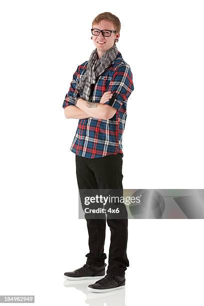 happy man standing with his arms crossed - one man only stock pictures, royalty-free photos & images