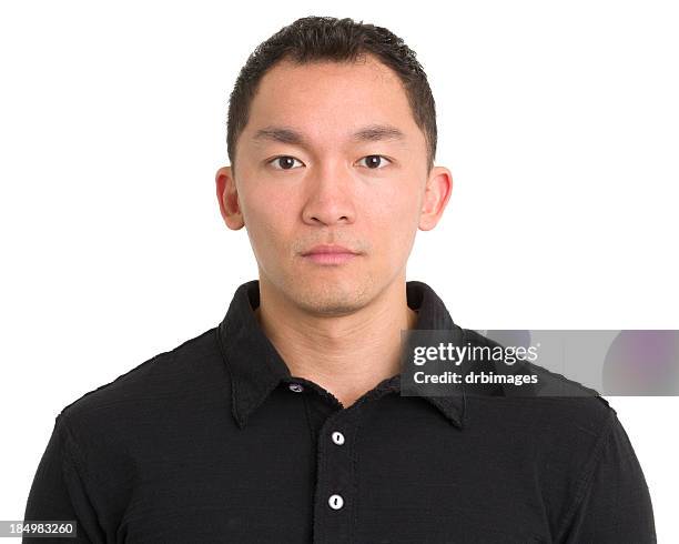 serious asian man staring - polo shirt stock pictures, royalty-free photos & images