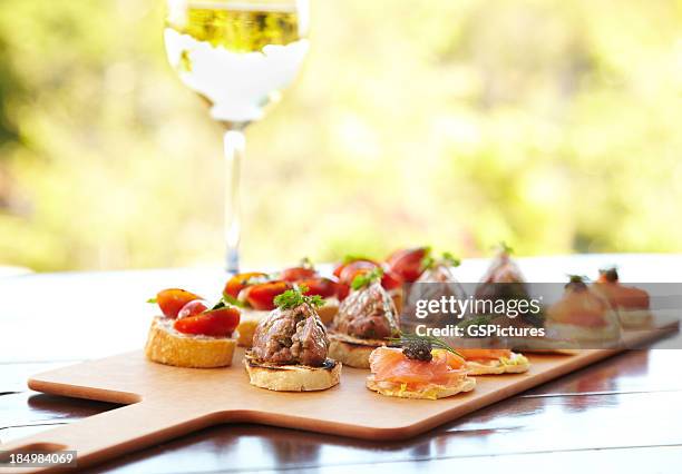 bruschetta with cheese, tomatoes, foie gras, and wild salmon - lunch tray stock pictures, royalty-free photos & images