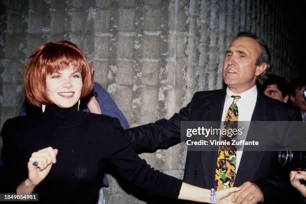 Canadian actress Lolita Davidovich, wearing a black turtleneck sweater, and American film director and screenwriter Ron Shelton attend the Westwood...