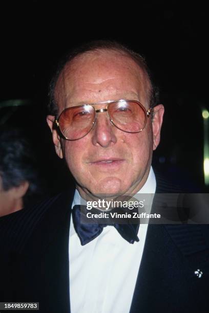 American music executive Clive Davis, wearing a tuxedo and bow tie, attends the Field of Dreams Foundation Awards, held at the Beverly Hilton Hotel...