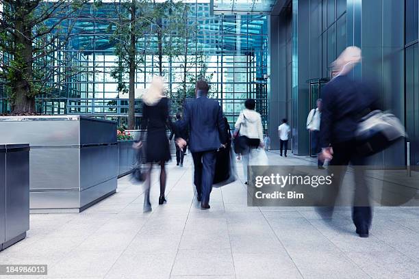 busy commute, blurred motion - city sidewalk stock pictures, royalty-free photos & images