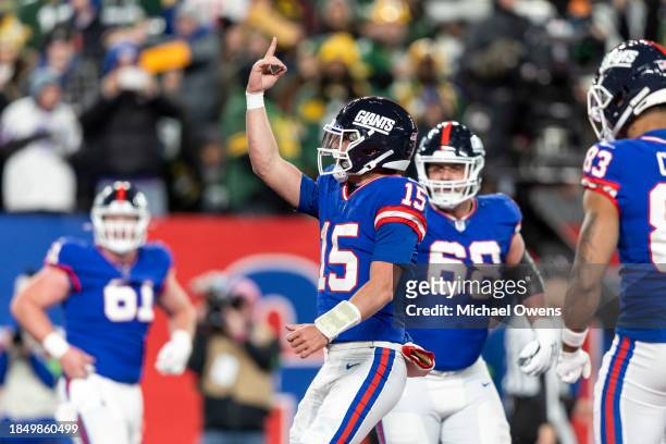 Tommy DeVito of the New York Giants celebrates after a touchdown during an NFL football game between the New York Giants and the Green Bay Packers at...