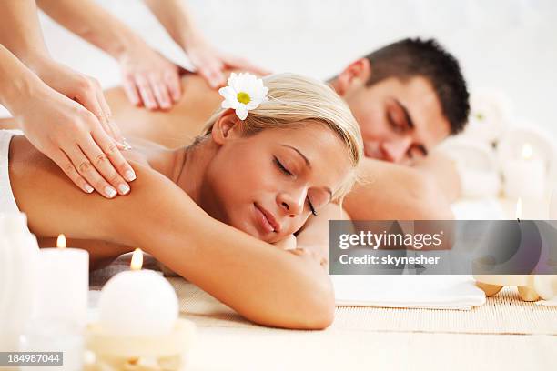 beautiful couple enjoying in the back massage. - massage couple 個照片及圖片檔