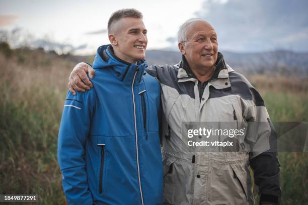 grandfather and grandson bond - old guy stock pictures, royalty-free photos & images