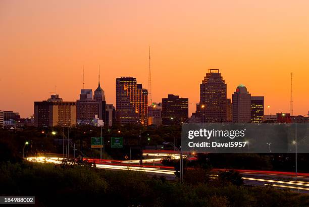 san antonio skyline and highway at dusk - san antonio stock pictures, royalty-free photos & images