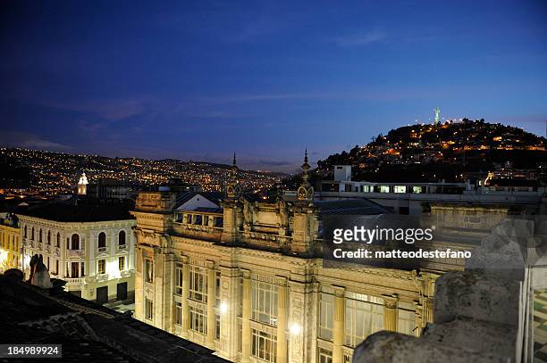 view of quito at nighttime with city in the background - quito stock pictures, royalty-free photos & images