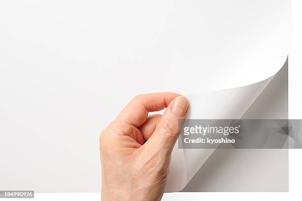 close-up shot of opening a blank page by the hand - bent stock pictures, royalty-free photos & images