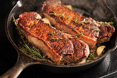 Strip Loin (New York) Steaks in a cast iron pan