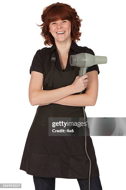 feliz mulher segurando o secador de cabelo - secador de cabelo - fotografias e filmes do acervo