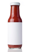 Glass bottle of tomato ketchup with a blank label