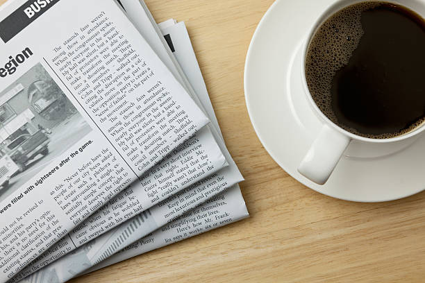 coffee and the morning paper - newspaper coffee stock pictures, royalty-free photos & images