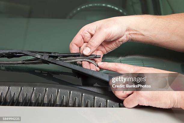 mechanic’s hand holding broken windshield wiper blade - broken egg bildbanksfoton och bilder