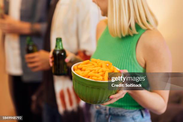 serving snacks at the party - cheese puff stock pictures, royalty-free photos & images