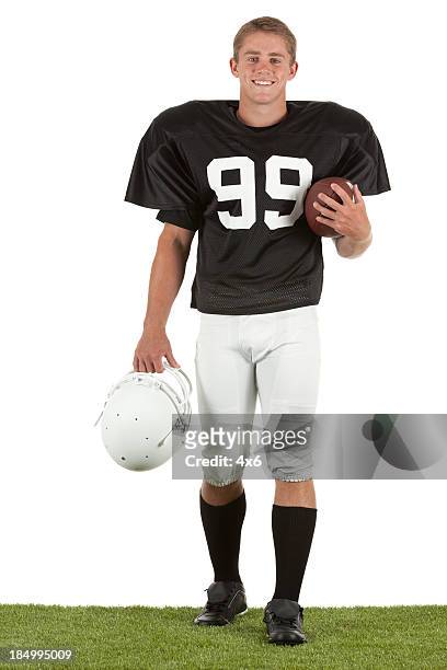 portrait of happy american football player - american football player isolated stock pictures, royalty-free photos & images
