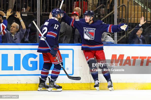 Jimmy Vesey of the New York Rangers celebrates with Nick Bonino after scoring during the game against the Los Angeles Kings on December 10, 2023 at...