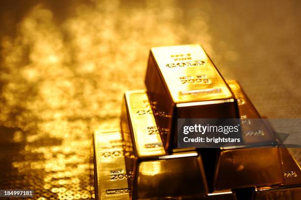 stack of gold bars - bullion stockfoto's en -beelden