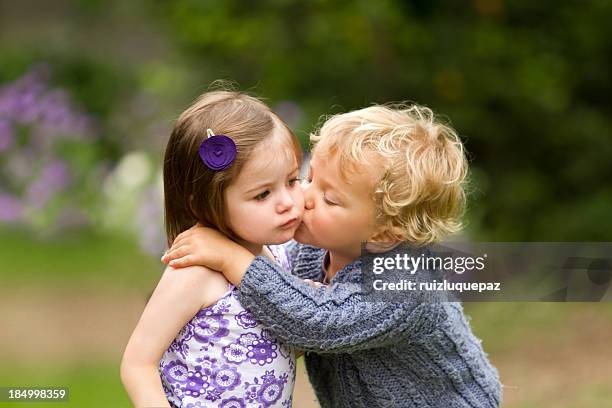 my first kiss - boy girl kissing stock pictures, royalty-free photos & images