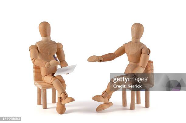 two wooden mannequin placed as if having a conversation - artists model stock pictures, royalty-free photos & images