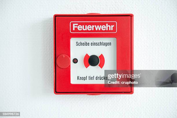 german fire alarm box on a wall - burglar alarm stock pictures, royalty-free photos & images