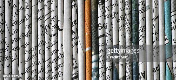 rolled newspaper pages - newspaper stock pictures, royalty-free photos & images