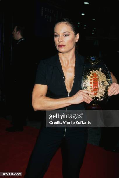 Women's champion Ivory holding her title belt during the NATPE Convention at the Las Vegas Convention Center, Las Vegas, January 23rd 2001.