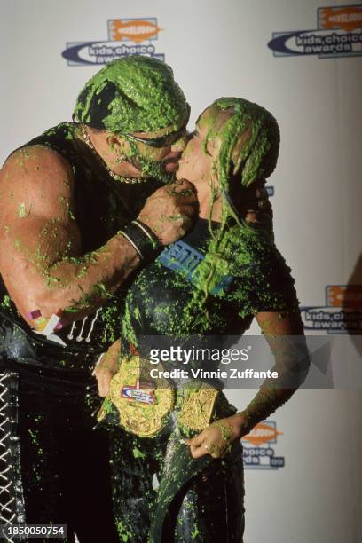 American wrestlers 'Macho Man' Randy Savage and Stephanie Bellars are covered in green slime at the Nickelodeon Kids' Choice Awards at the Pauley...
