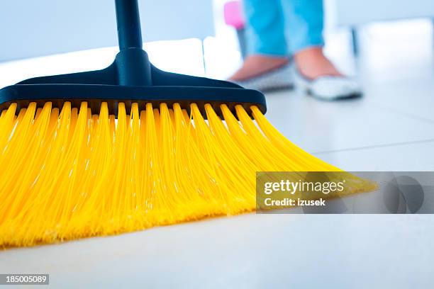 broom - woman sweeping stock pictures, royalty-free photos & images